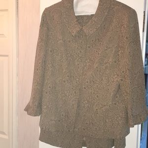 Skirt suit. Jacket has bell sleeves.